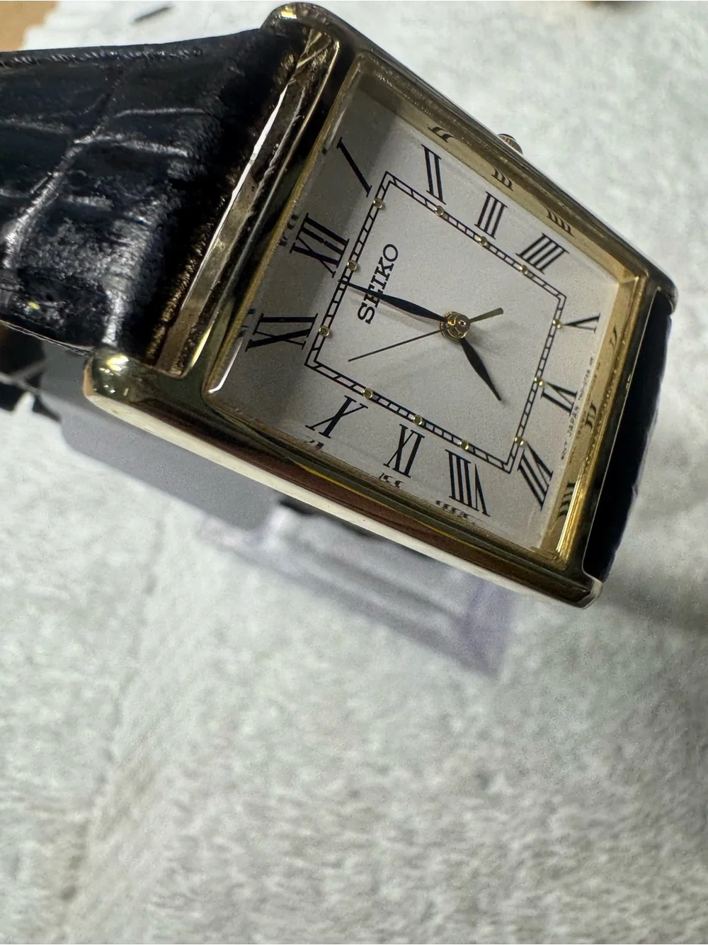 Seiko White Dial Watch with Black Strap and Gold Accents